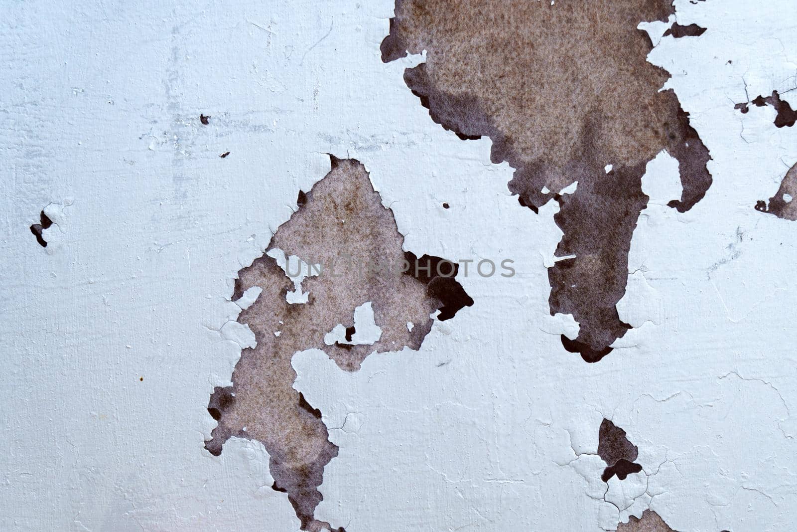 White peeling paint rust texture grunge background of a white painted.