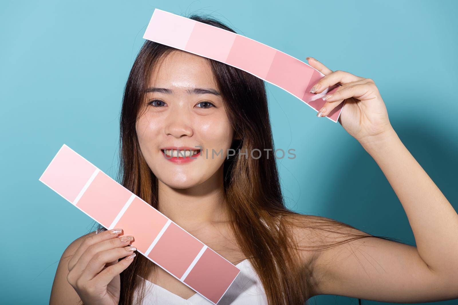 Portrait of happy female hold color card under sun protection by Sorapop