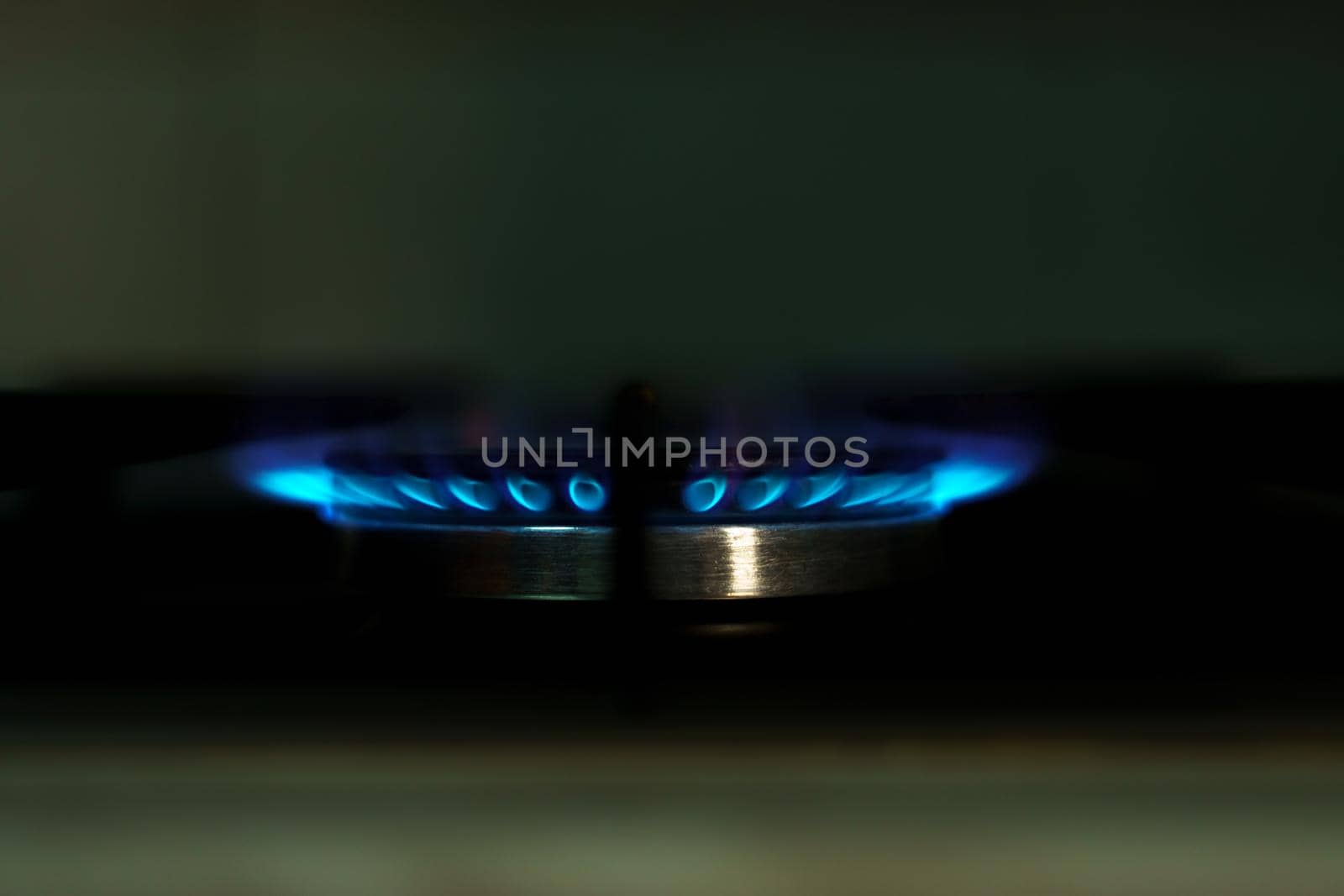 close-up of the flame of a butane stove with black background
