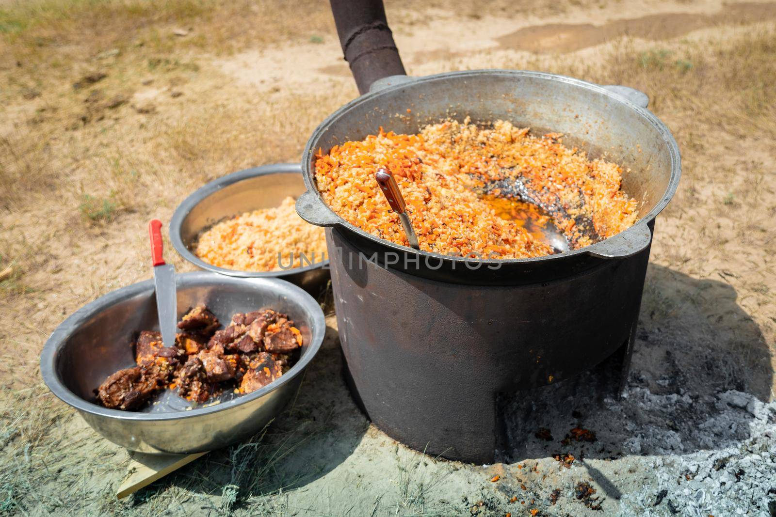 Central Asian cuisine, catering in the form of pilaf in the steppe.