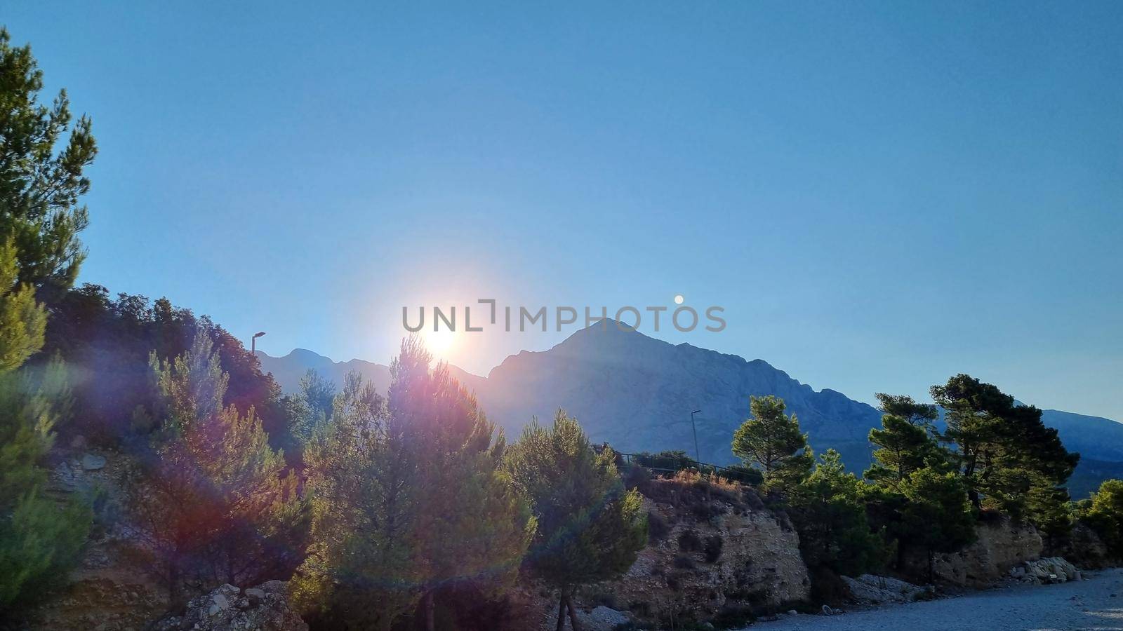 Sunrise over Biokovo Mountain Nature park and trees from Makarska Riviera-Biokovo, Dalmatia, Croatia, Europe