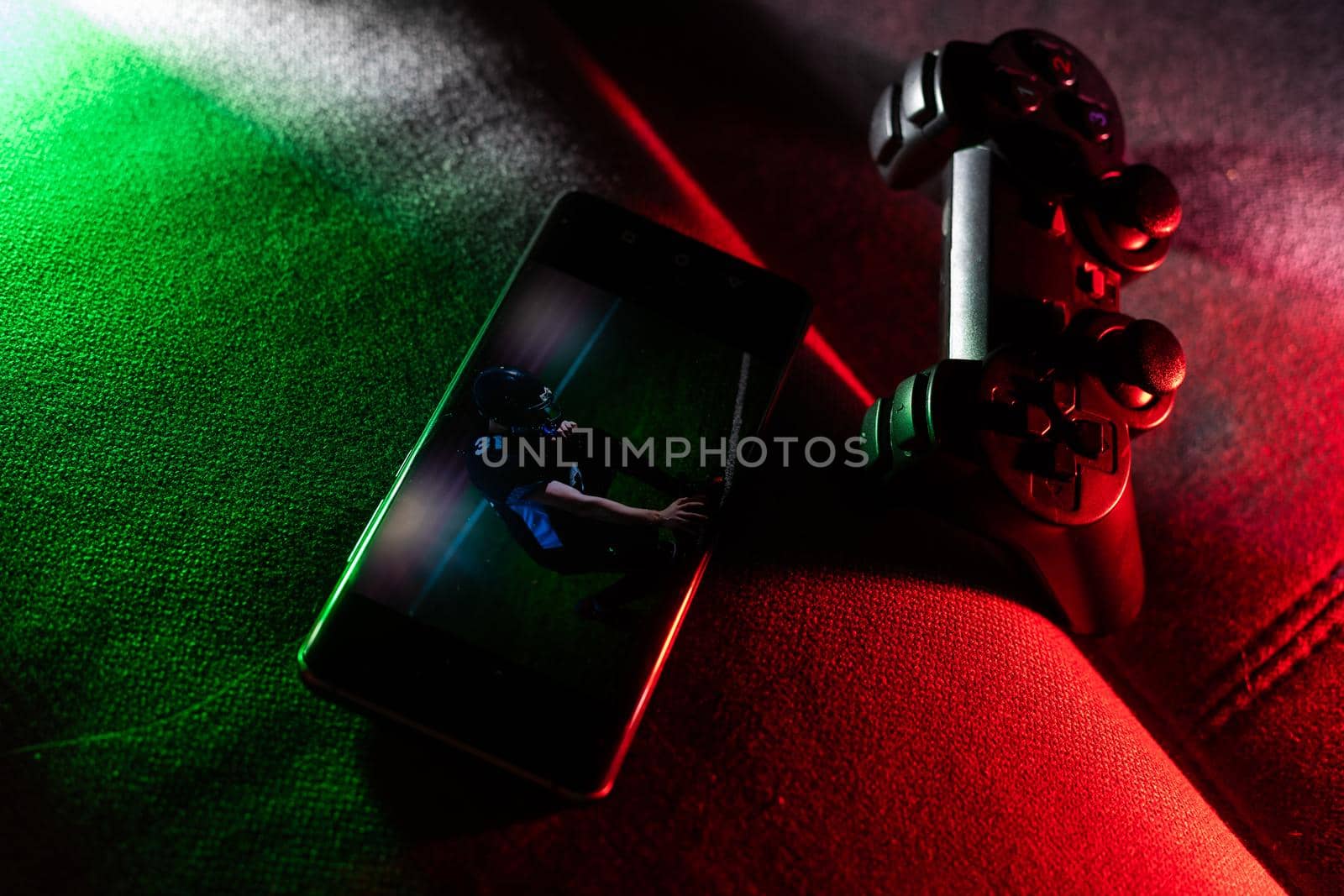 Smartphone and two game joysticks. Minimalism. Cybersport concept. Streaming