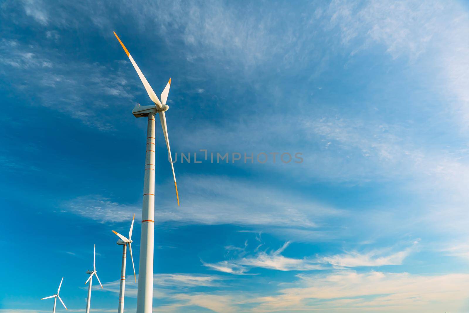 Green energy on wind turbines and wind turbines. Alternative energy sources and renewable energy sources. Power generation and generators of power plants.Wind farm and wind,environmental conservation