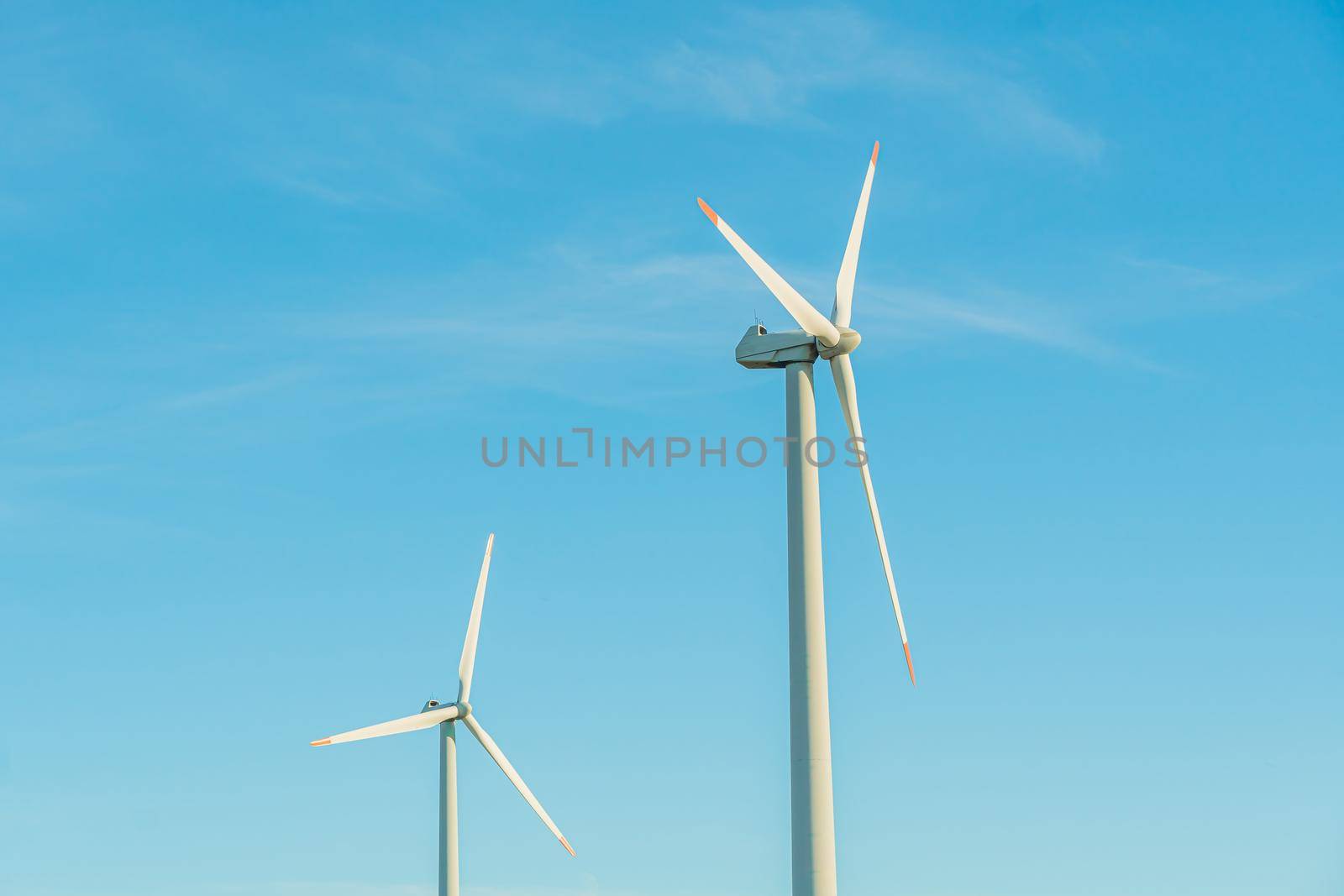 Green energy on wind turbines and wind turbines. Alternative energy sources and renewable energy sources. Power generation and generators of power plants.Wind farm and wind,environmental conservation