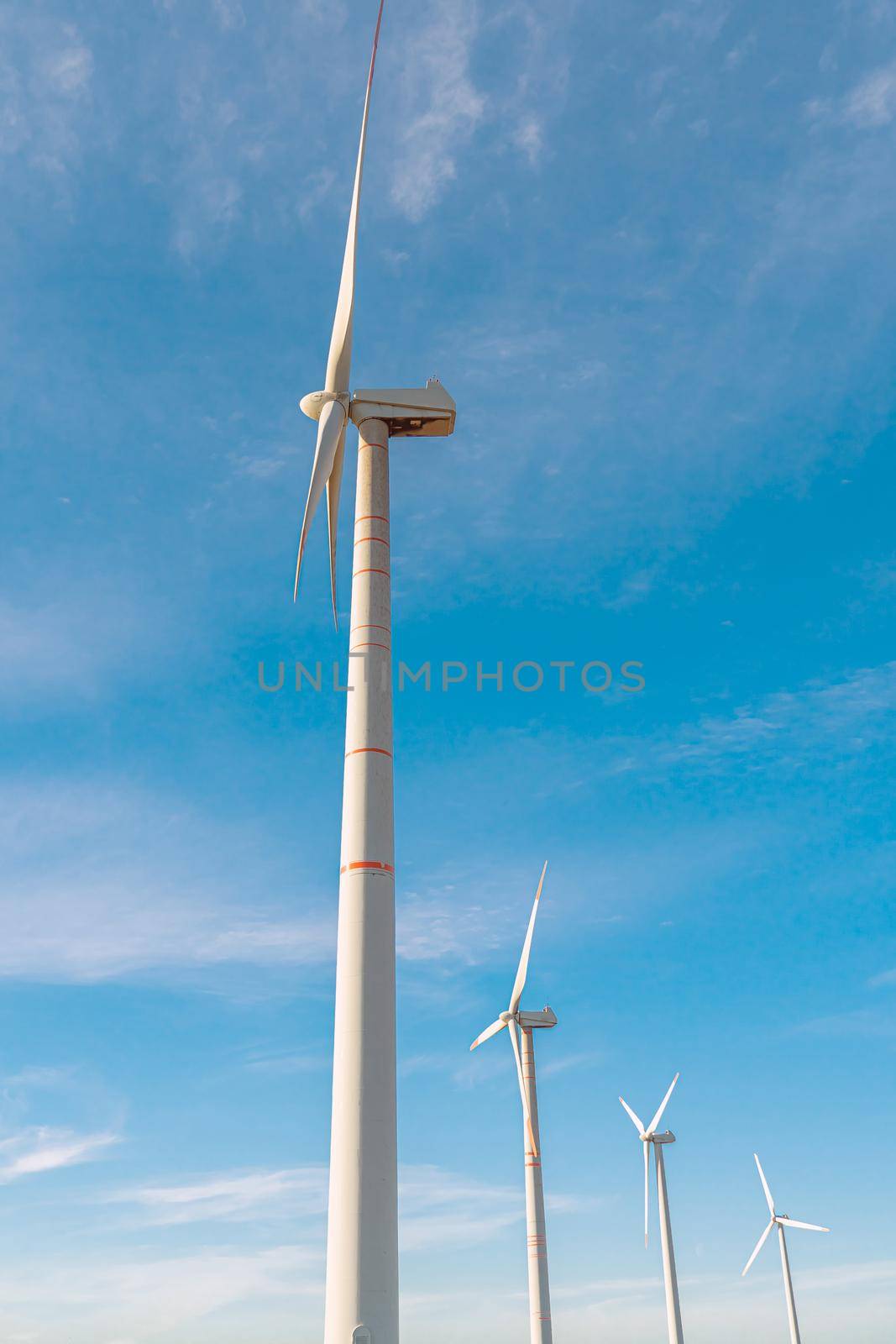 Green energy on wind turbines and wind turbines. Alternative energy sources and renewable energy sources. Power generation and generators of power plants.Wind farm and wind,environmental conservation by YevgeniySam