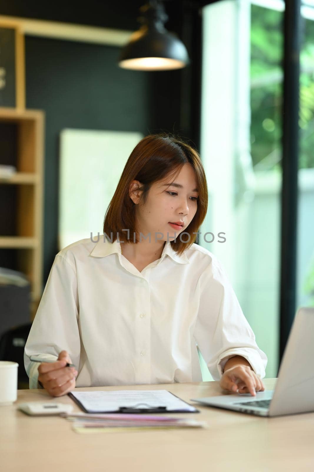 Professional businesswoman checking business email or checking online information on her laptop computer.