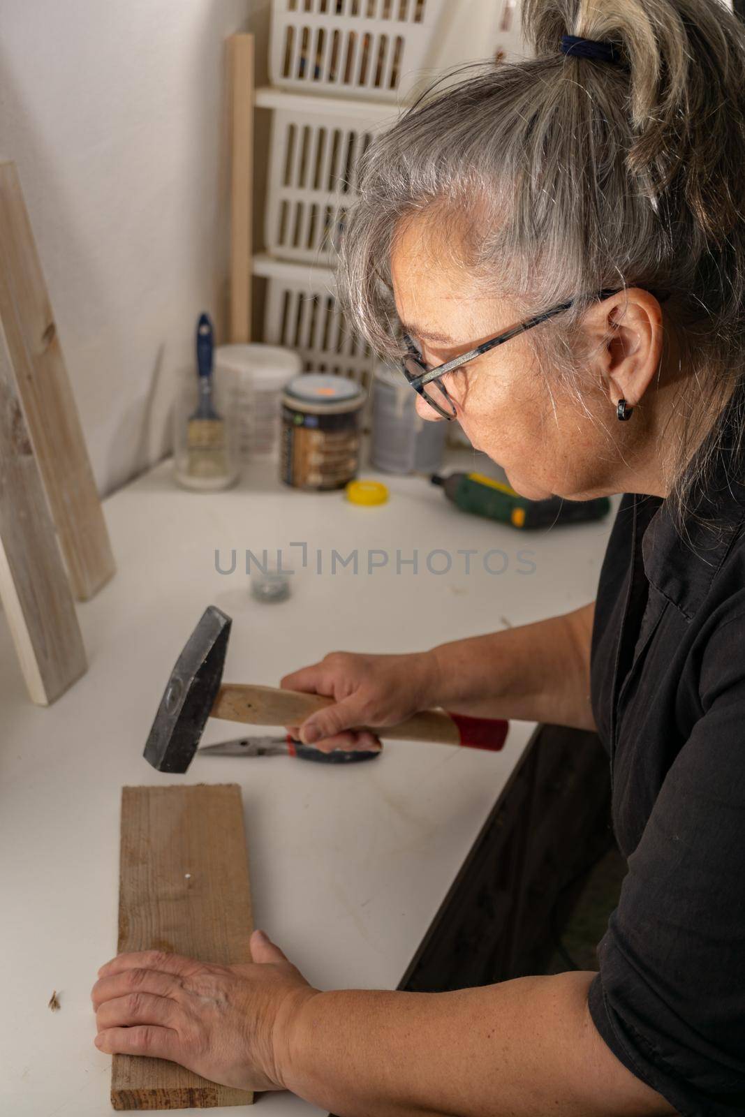 older woman working in her workshop by joseantona
