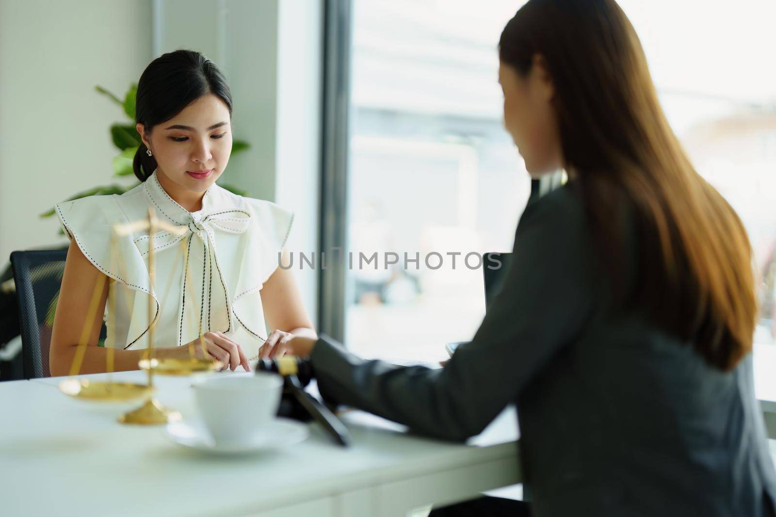 Law and legitimacy, portrait of lawyer and client signing important contract documents.