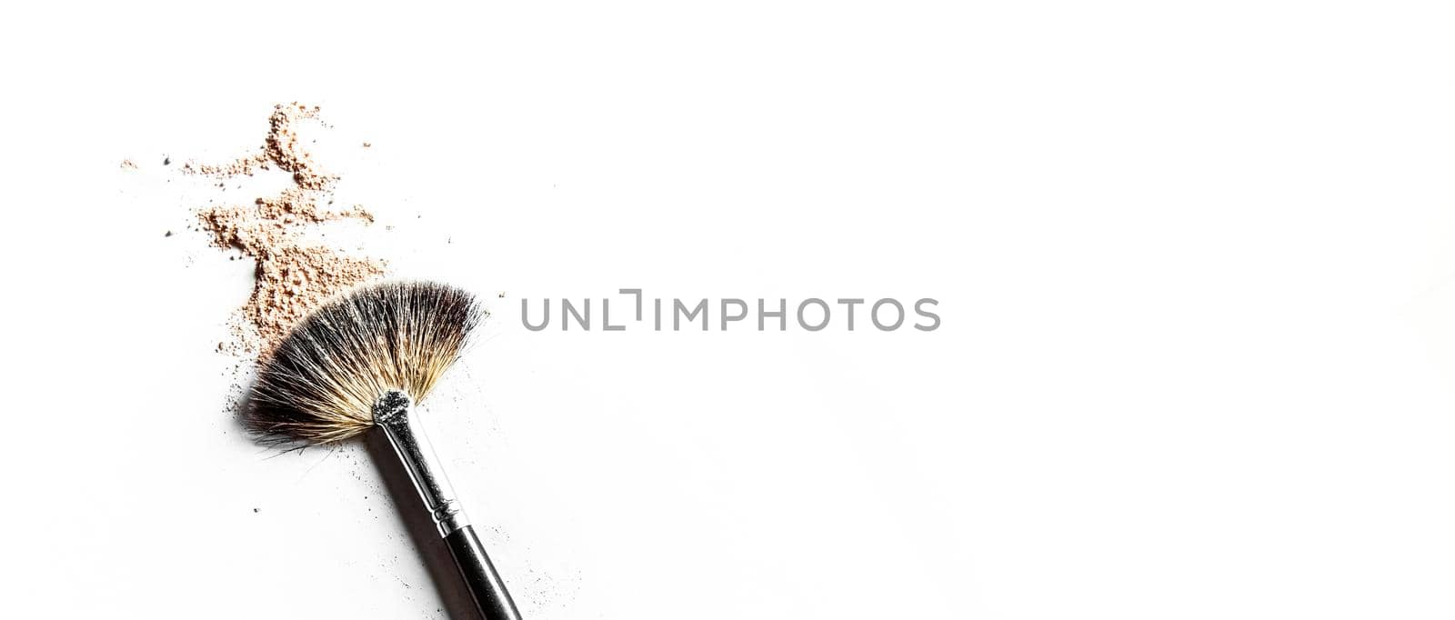 Beauty texture, cosmetic product and art of make-up concept - Brush and beige powder close-up isolated on white background