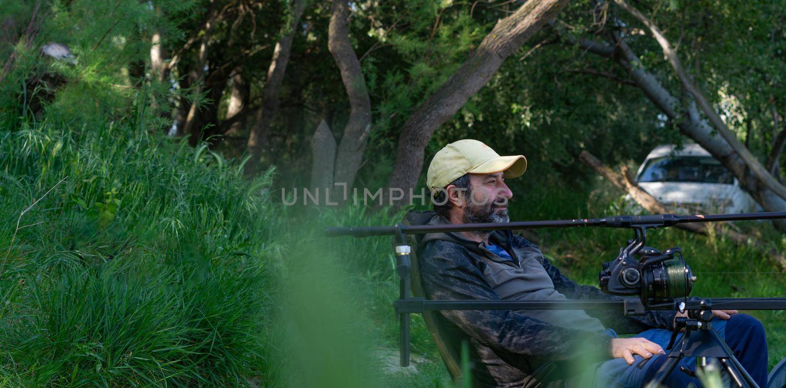 fishing session in the ebro river adult man with beard carp fishing