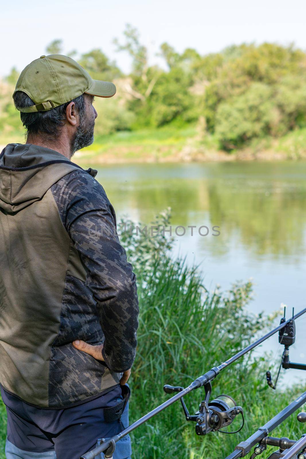 fishing session in the ebro river adult man with beard carp fishing