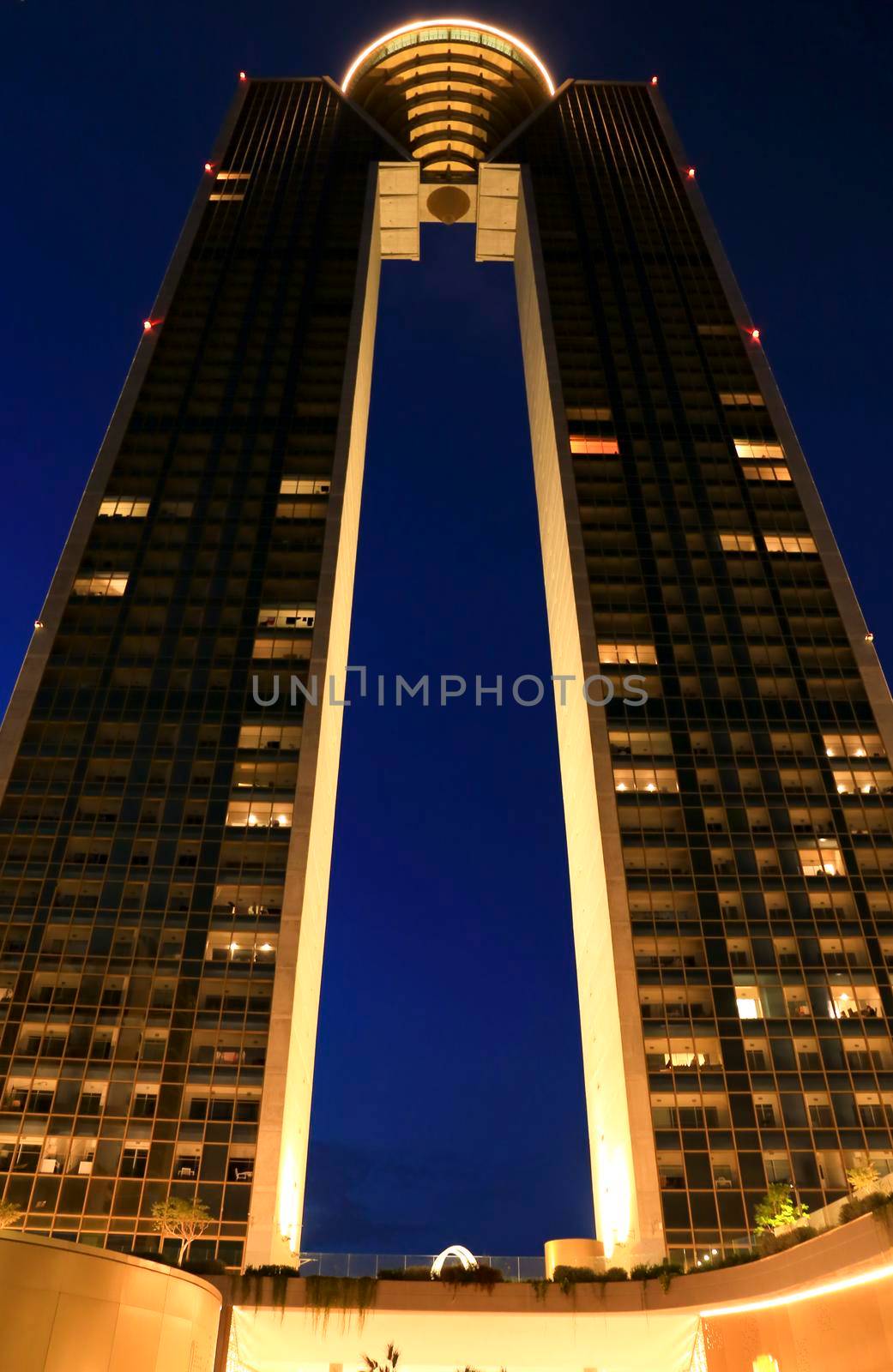 Benidorm, Alicante, Spain- September 11, 2022: Modern architecture building called Intempo on the Poniente Beach Area in Benidorm at night