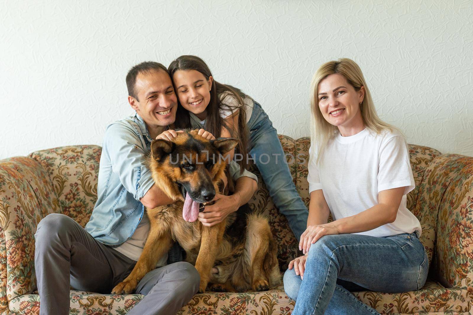 german shepherd and family. German shepherd is the best friend of the child