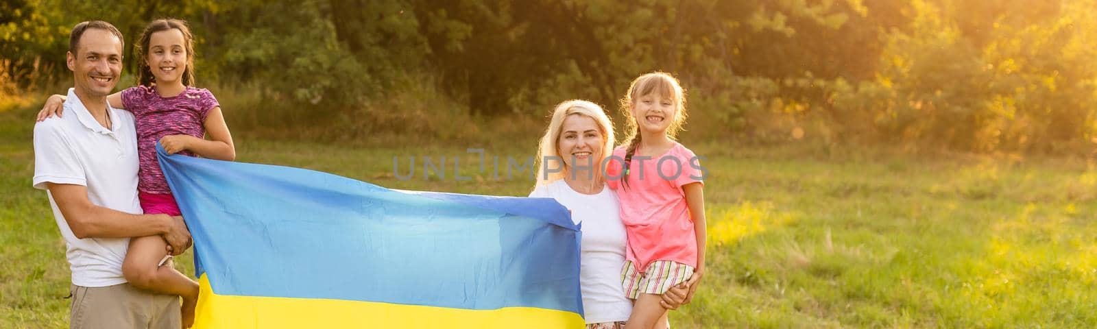 family with the flag of ukraine. Happy Independence Day of Ukraine. National Flag Day. Love for the homeland and symbols. Copy space