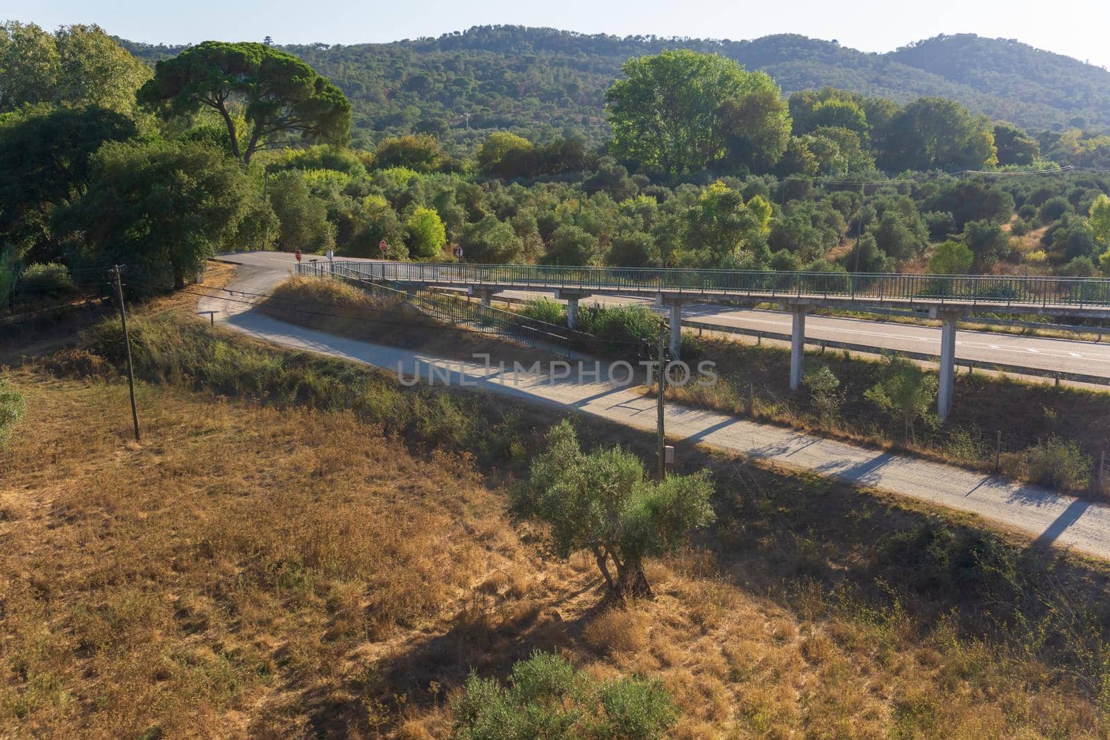 Pedestrian bridge over the road outside the city in Portugal