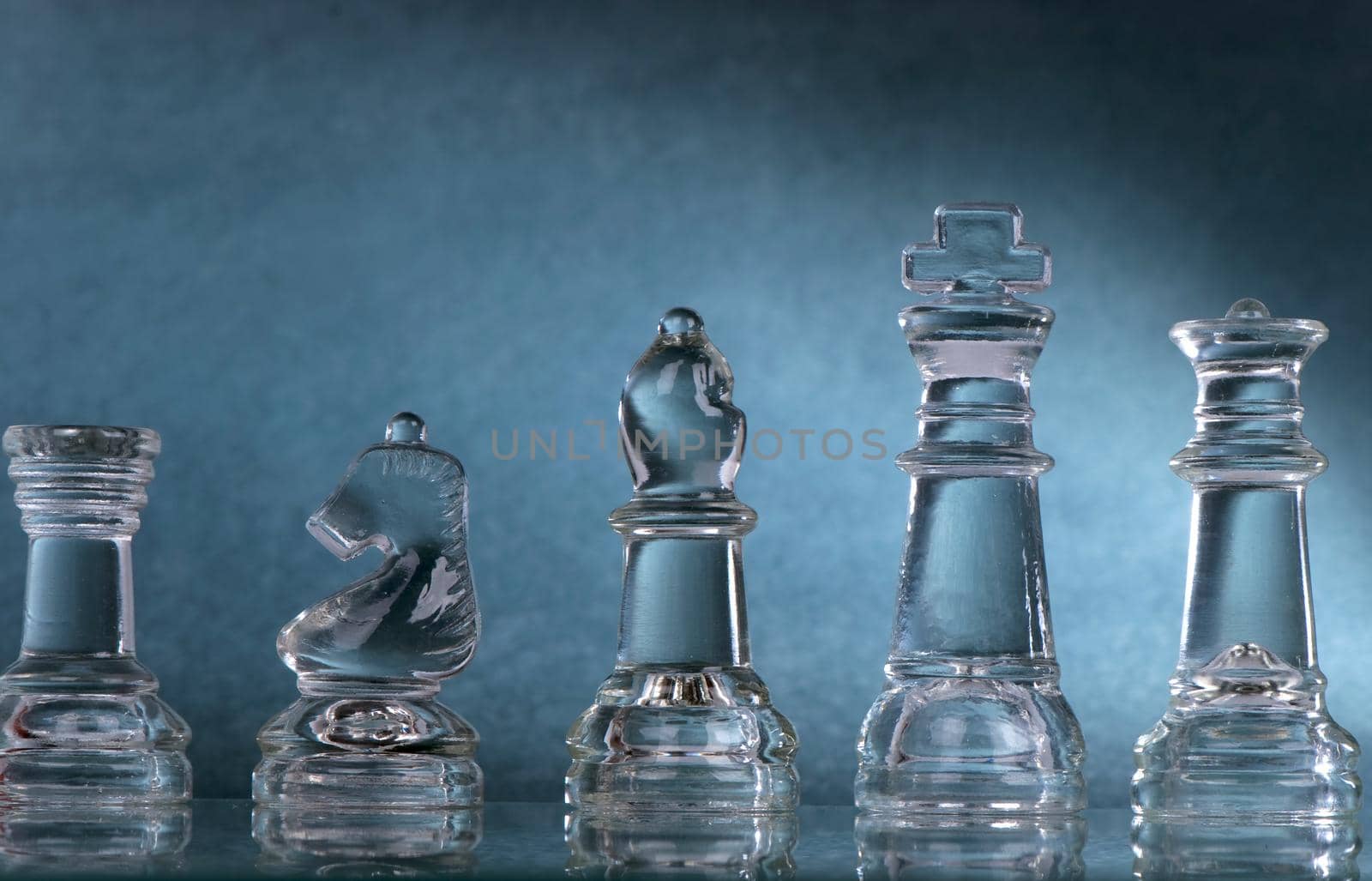 Glass chess is placed on black background by aprilphoto