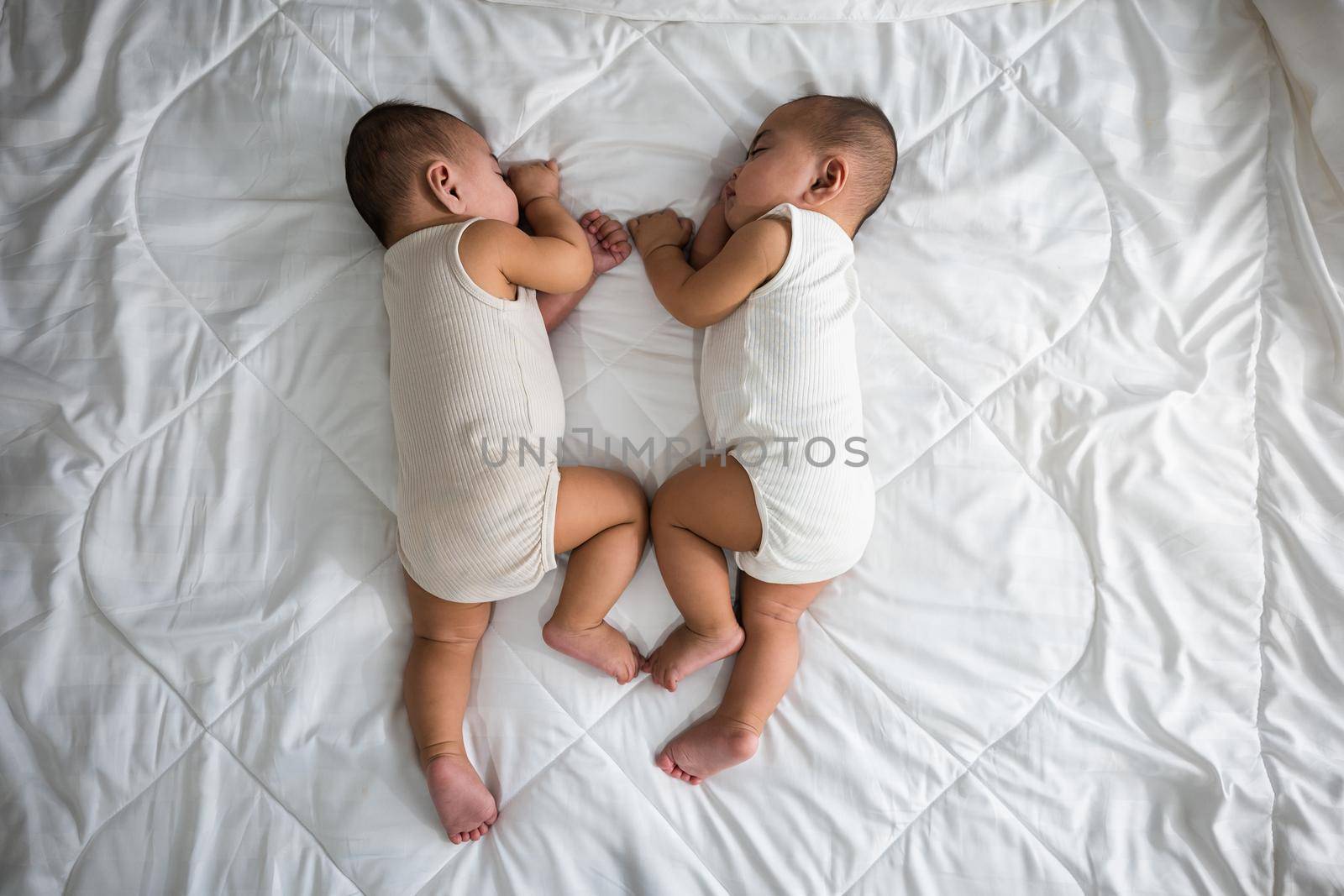 Asian two adorable twin babies boy, Happy childhood by Sorapop