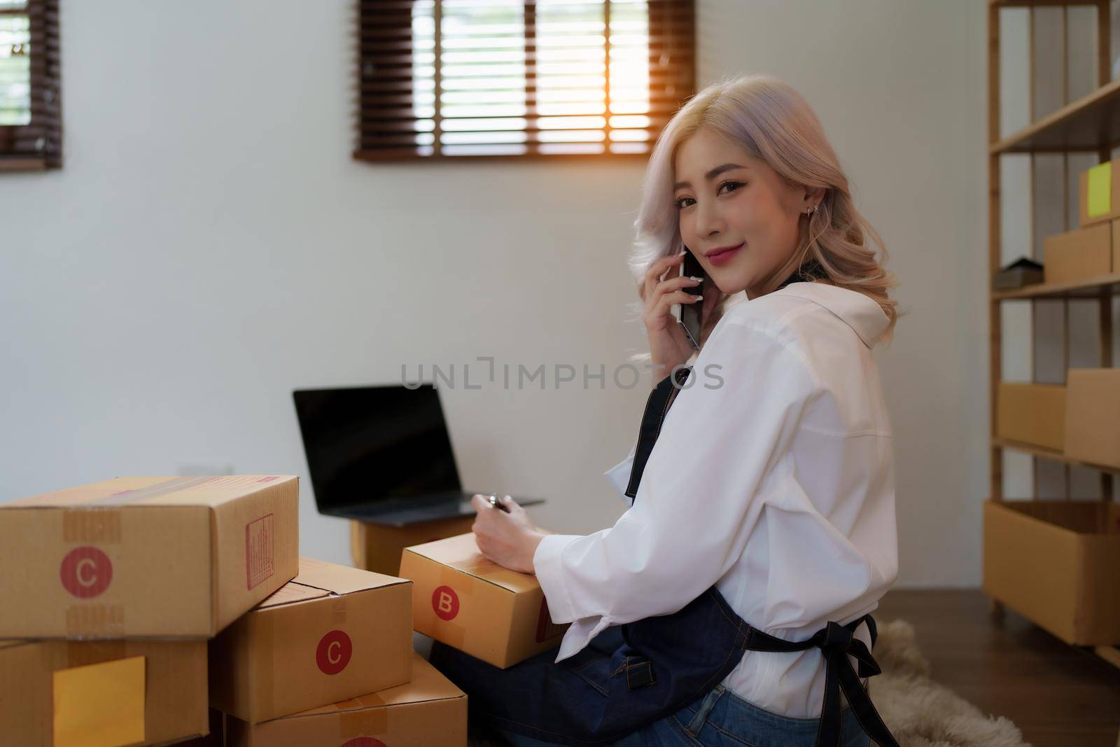 Asian SME business woman working at home office. online shopping concept