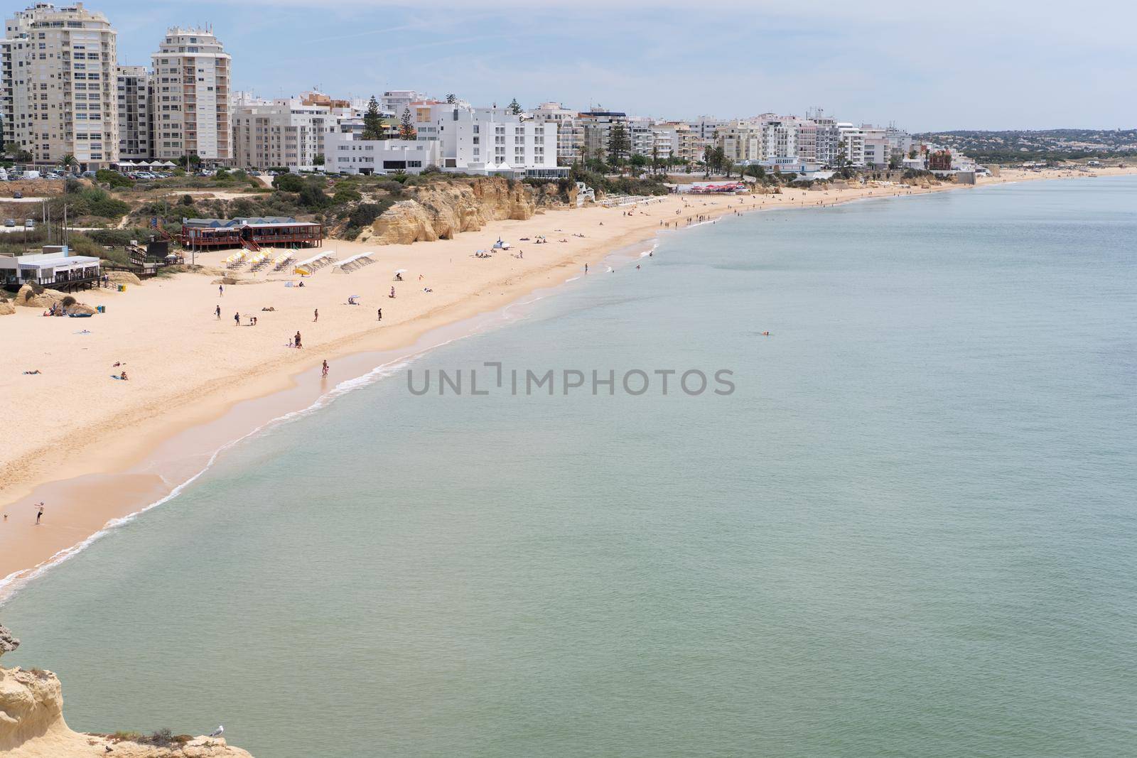 Armacao de Pera Algarve Portugal. Beautiful view on Atlantic ocean at day time and city by andreonegin