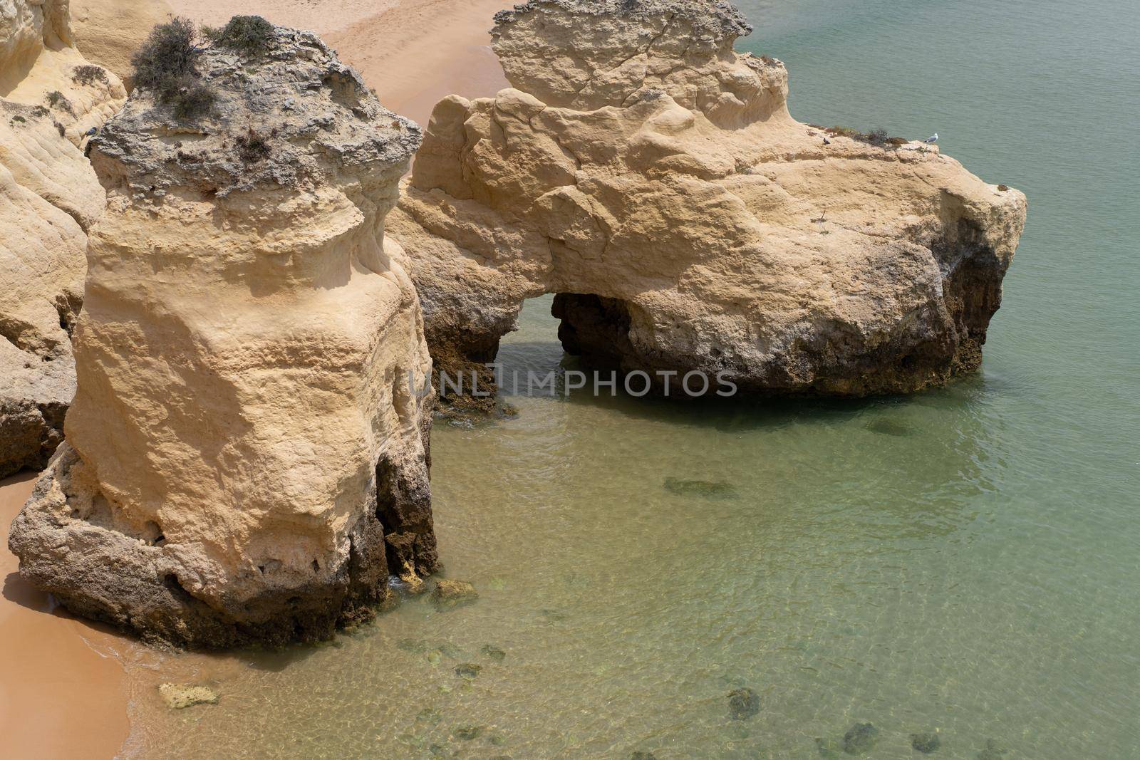 The rocky cliffs of Vale do Olival beach in Armacao de Pera, Portugal. High quality 4k footage