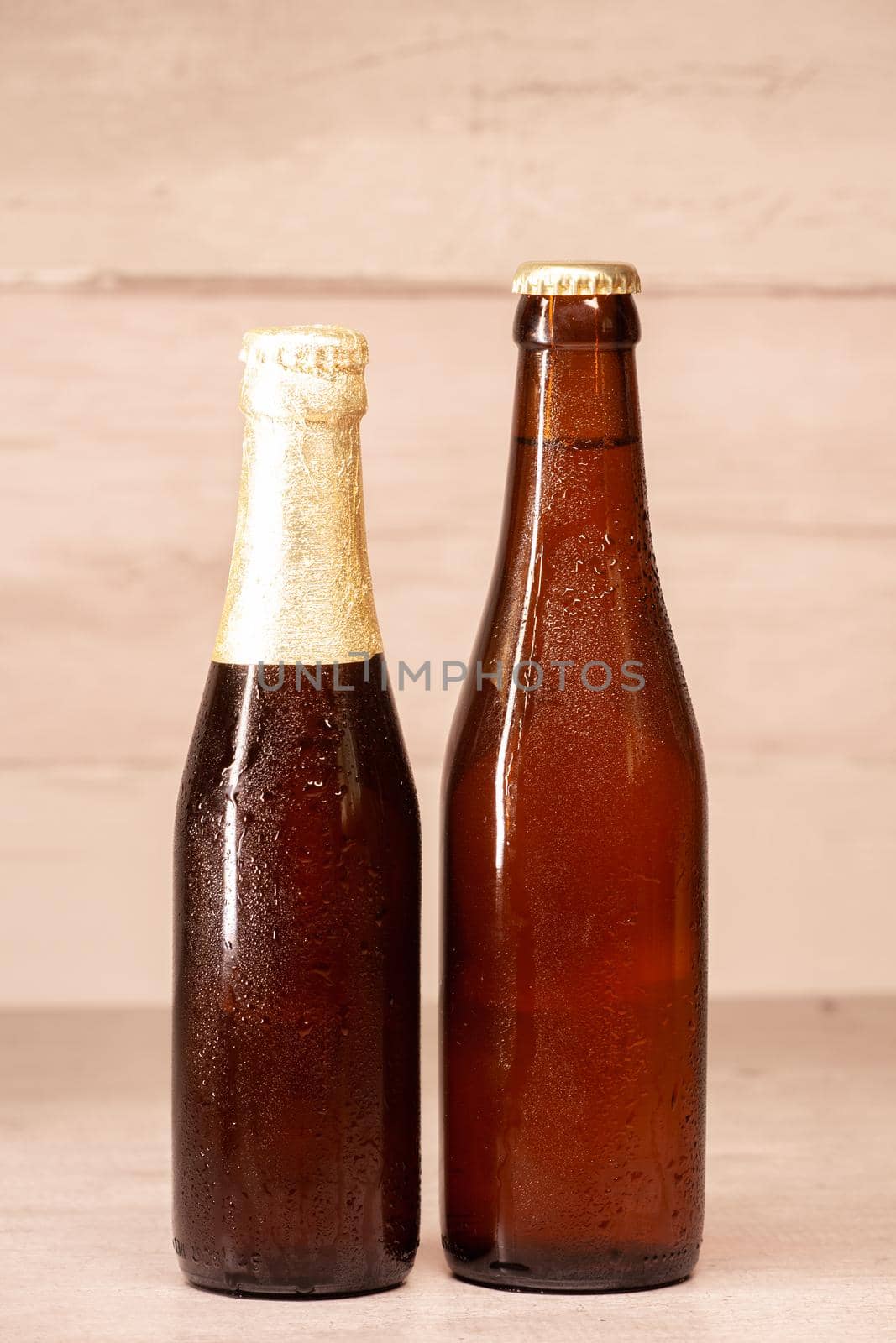 a bottle of blond beer and a bottle of amber beer