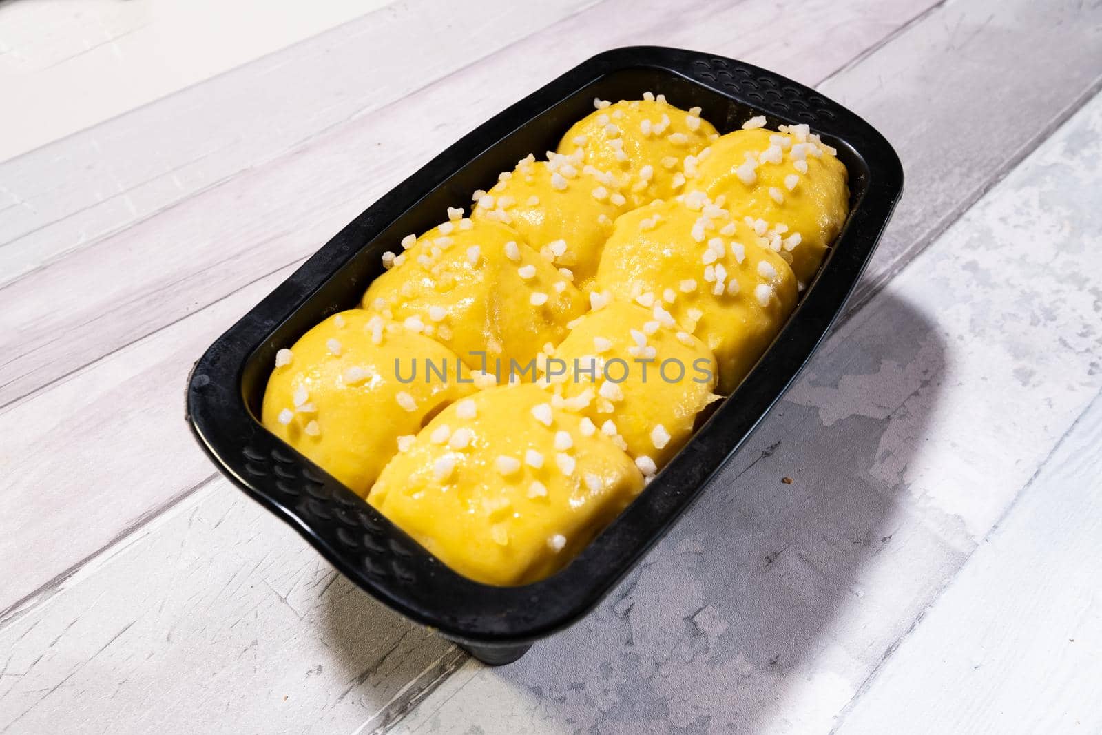 Brioche dough with butter and sugar in a silicone mold before going into the oven