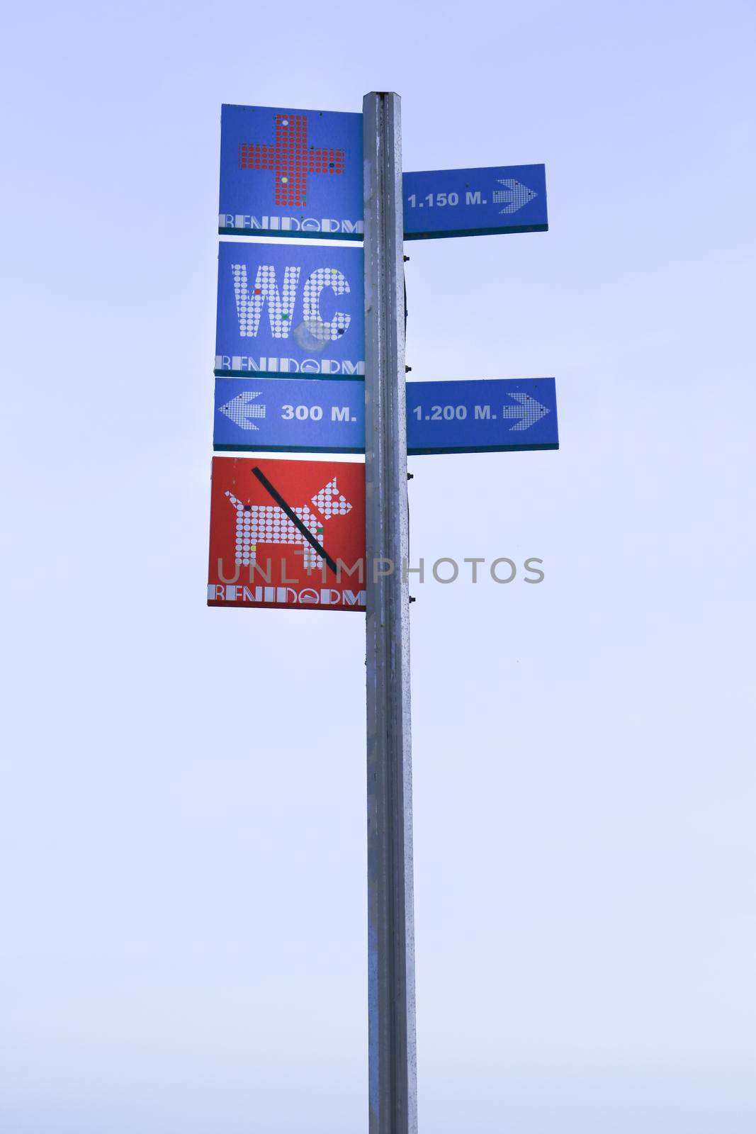 Benidorm, Alicante, Spain- September 11, 2022: Metal post with touristic information on Poniente beach