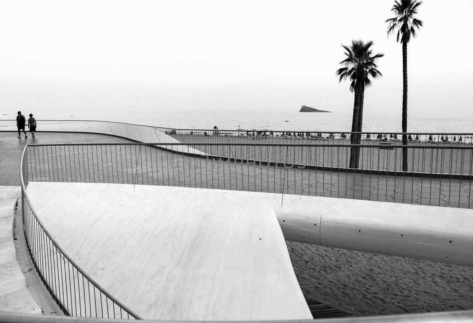 Benidorm, Alicante, Spain- September 11, 2022: Poniente beach with its beautiful promenade with access to the beach and viewpoint with modern design