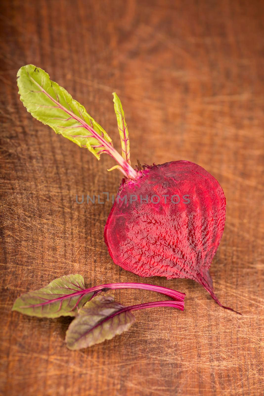 Red beet with leaves or beetroot on the wooden by aprilphoto