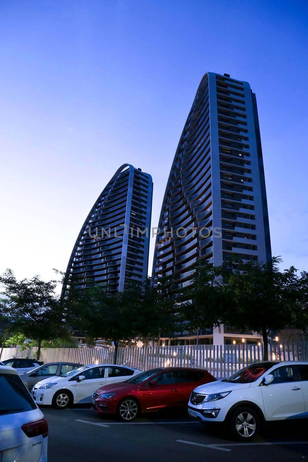 Benidorm, Alicante, Spain- September 11, 2022: Modern architecture buildings called Sunset Waves on the Poniente Beach Area in Benidorm at night