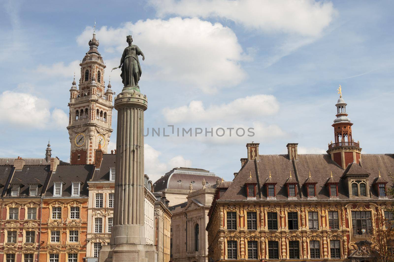 Historic facades at the Grand Place in the city of Lille, the belfry of the Chambre de Commerce in background.