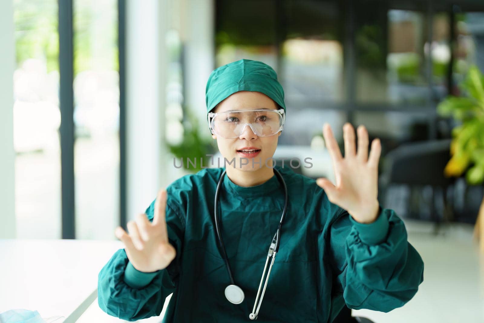 Portrait of an Asian healer showing gestures, describing body structure patterns. by Manastrong