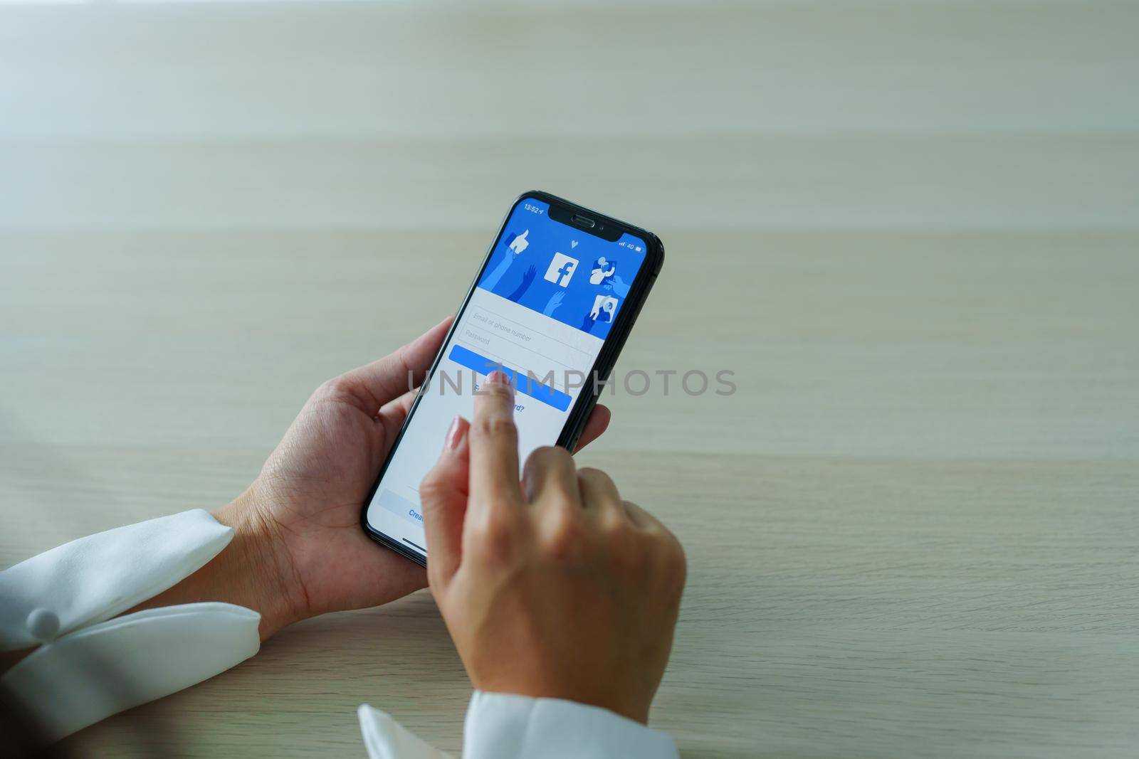 Chiang Mai Thailand. Sep 08, 2022. Woman holds smart phone with facebook application on the screen. facebook is a photo-sharing app for smartphones