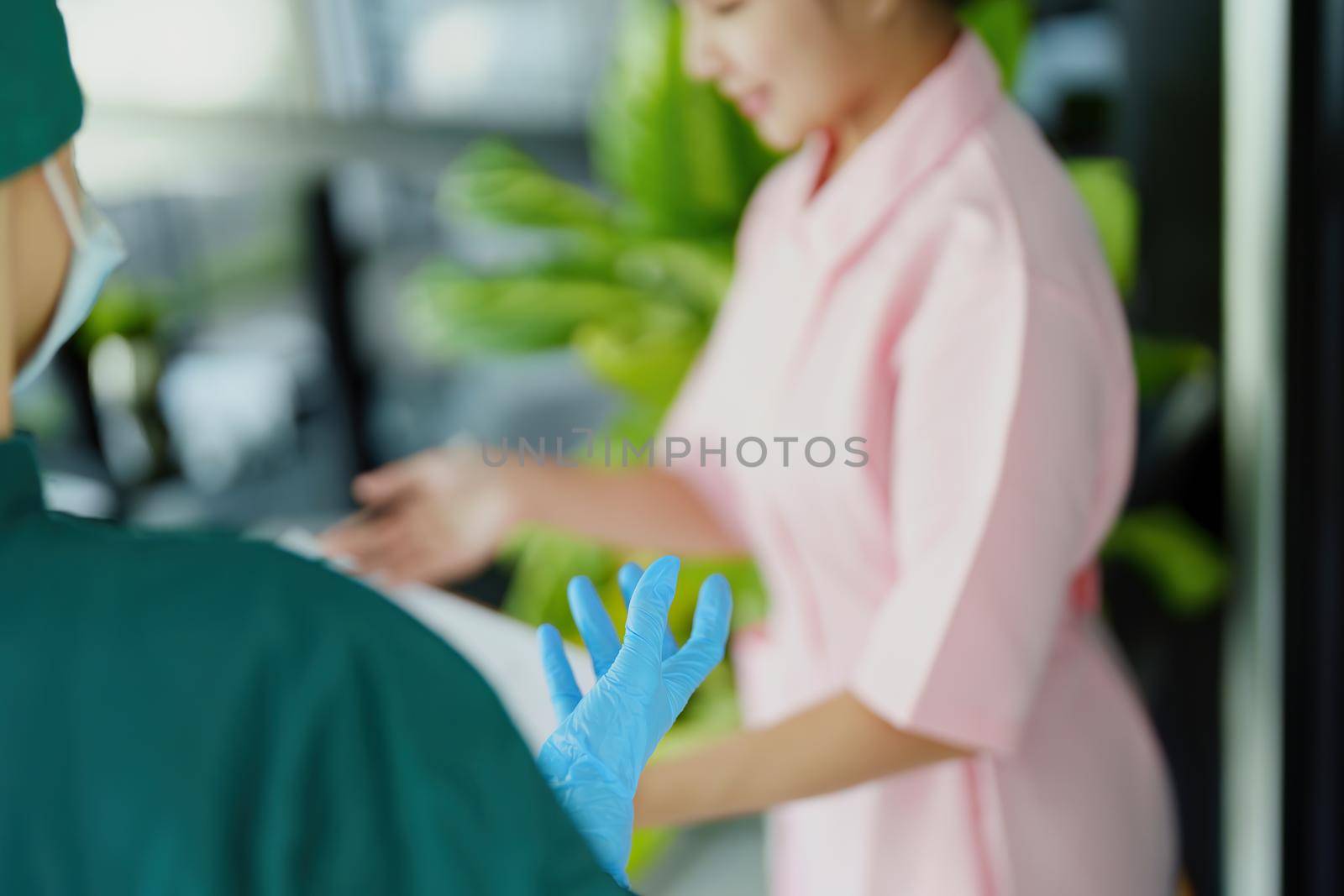 doctor and nurse talking before going into the operating room. by Manastrong