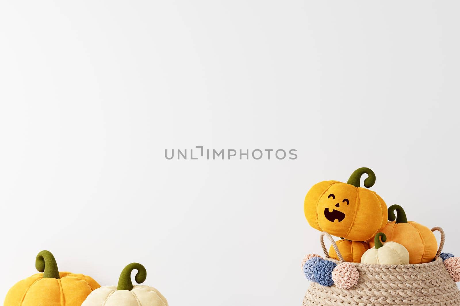 Halloween copyspace background with pumpkins in basket on white background, smiling pumpkin face, 3D rendering, Halloween theme with pumpkins in woven basket on white background 3D illustration.