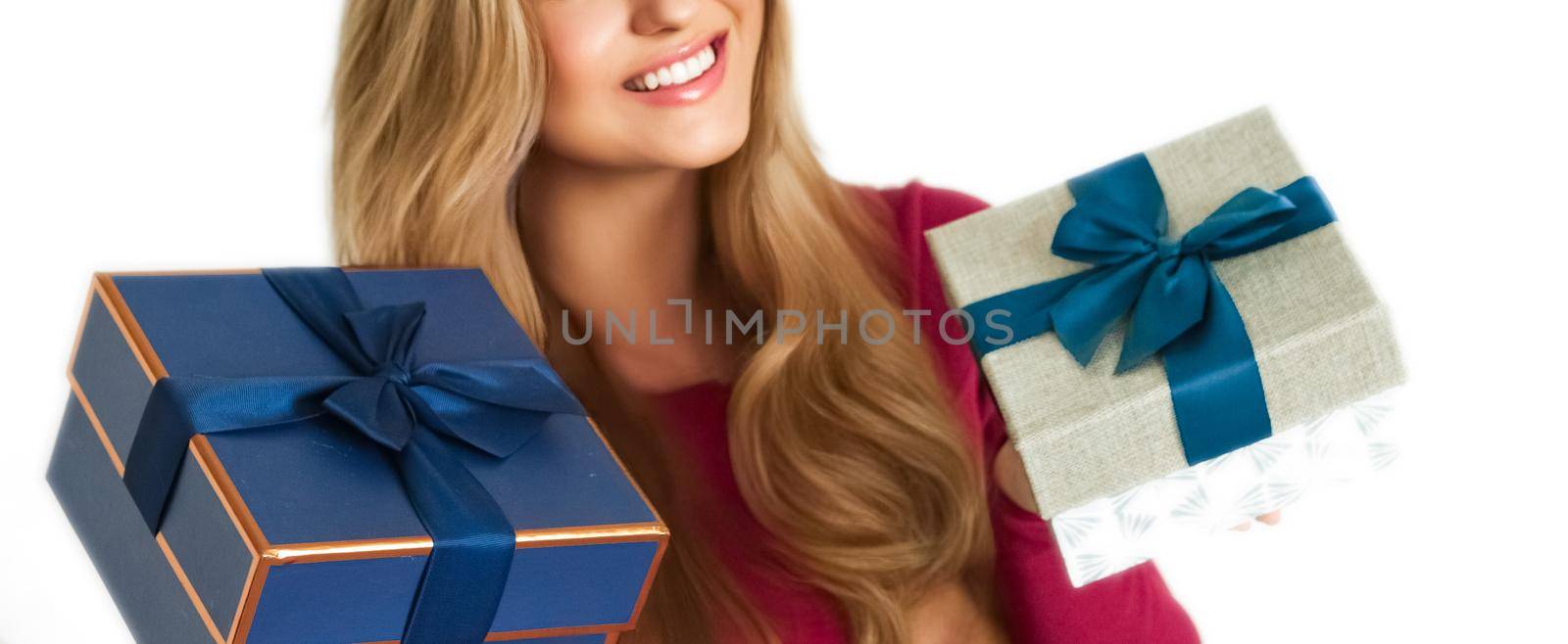 Birthday, Christmas gifts or holiday present, happy woman holding gift boxes isolated on white background, portrait