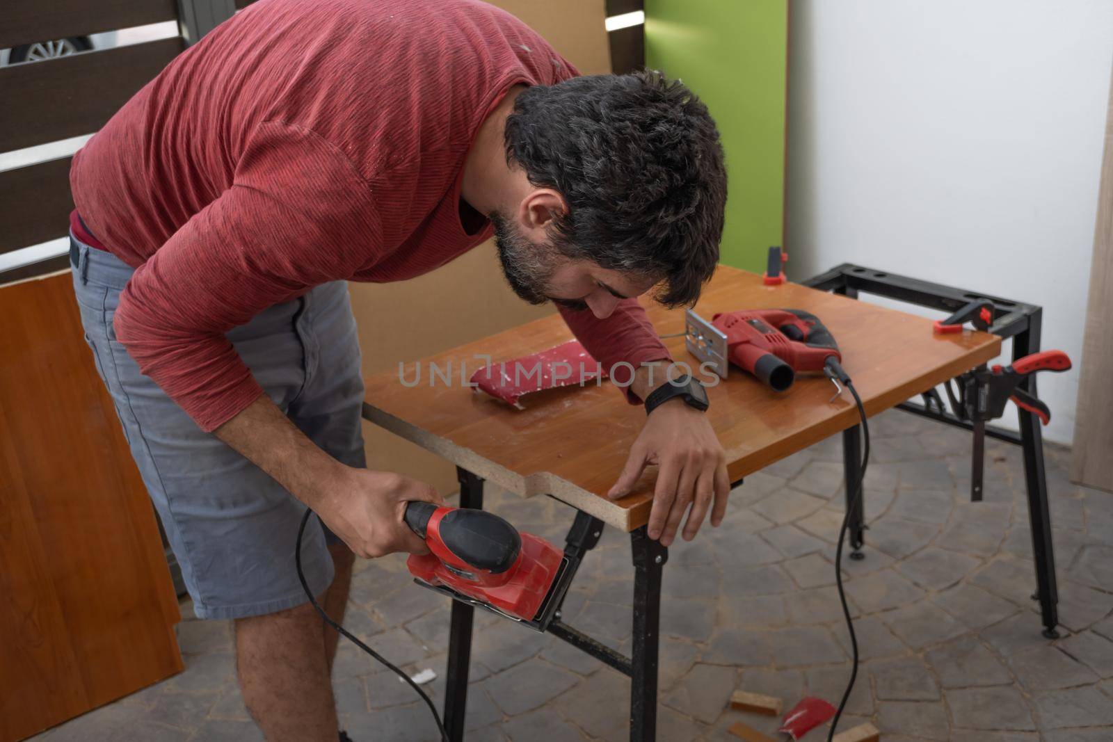 man using power tools by joseantona