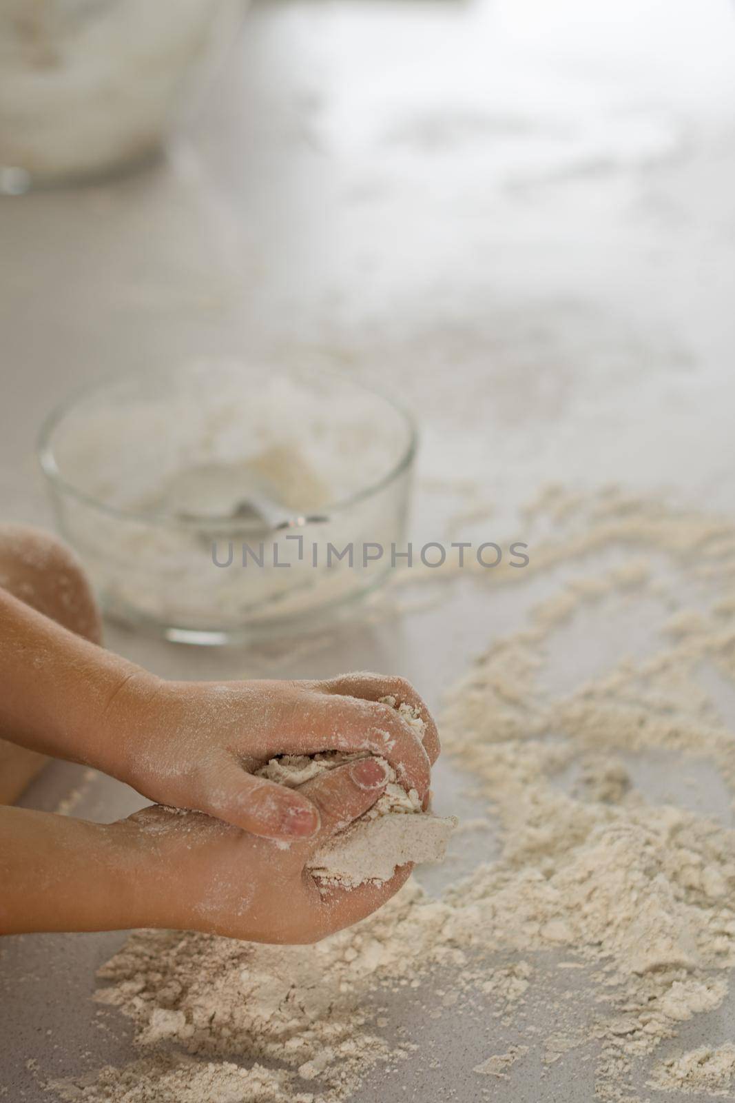 man making homemade bread with his son by joseantona