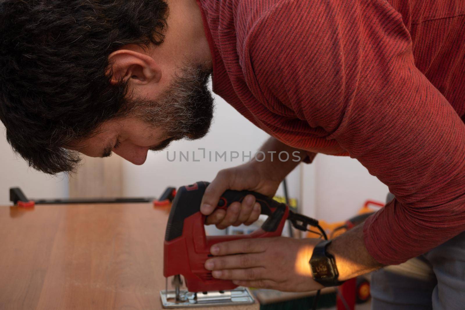 man using power tools by joseantona
