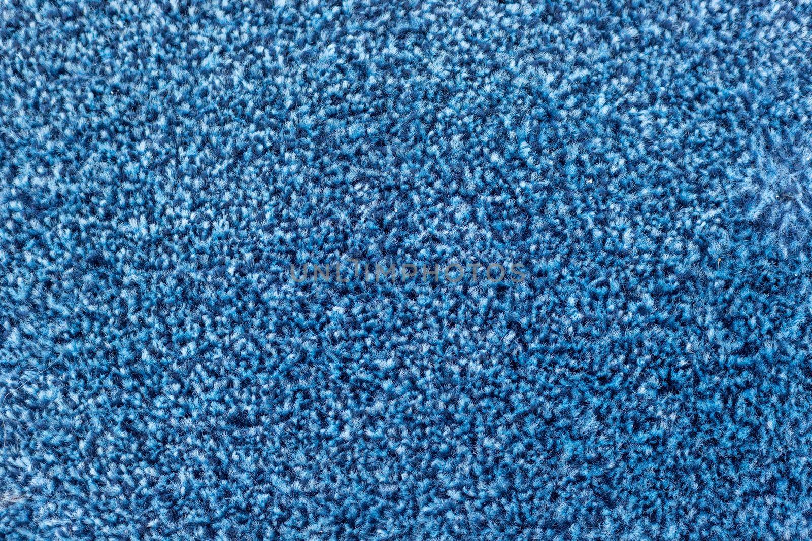 Blue carpet texture background closeup by Bilalphotos