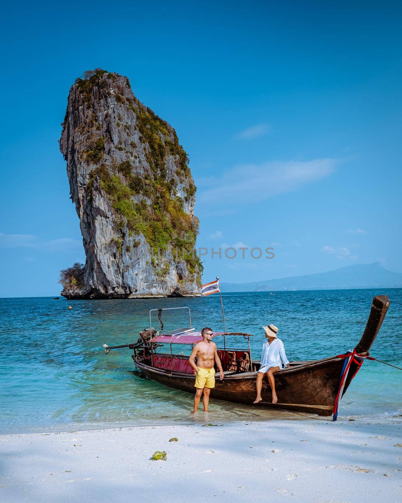 Koh Poda Island Krabi Thailand, couple mid age Asian woman and a European man on the beach, Koh Poda Thailand, the beautiful tropical beach of Koh Poda, Poda Island in Krabi province