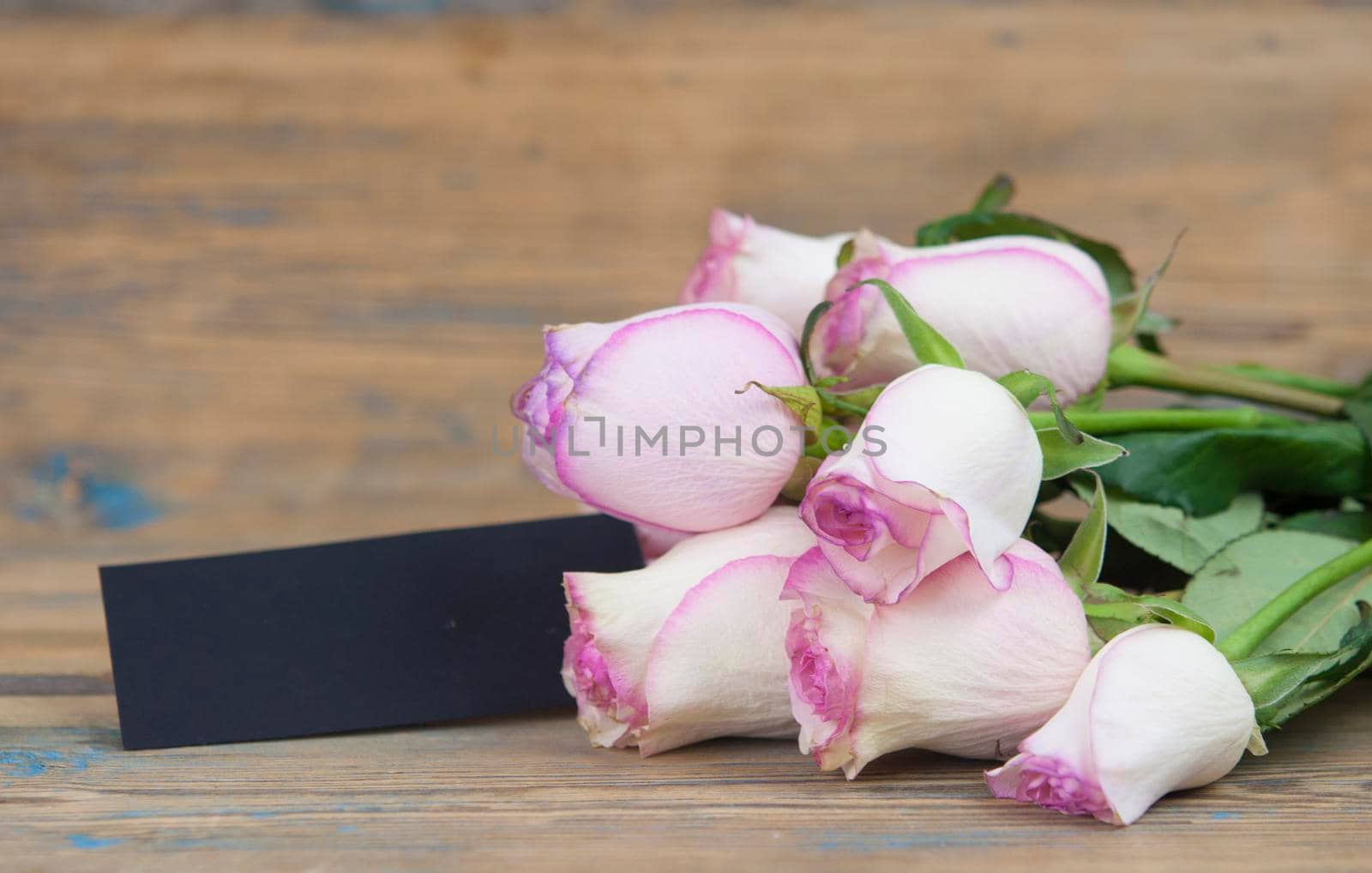 Pink roses on wood background. Mothers day roses, Bouquet of pink roses, Floral background image with copy space for text