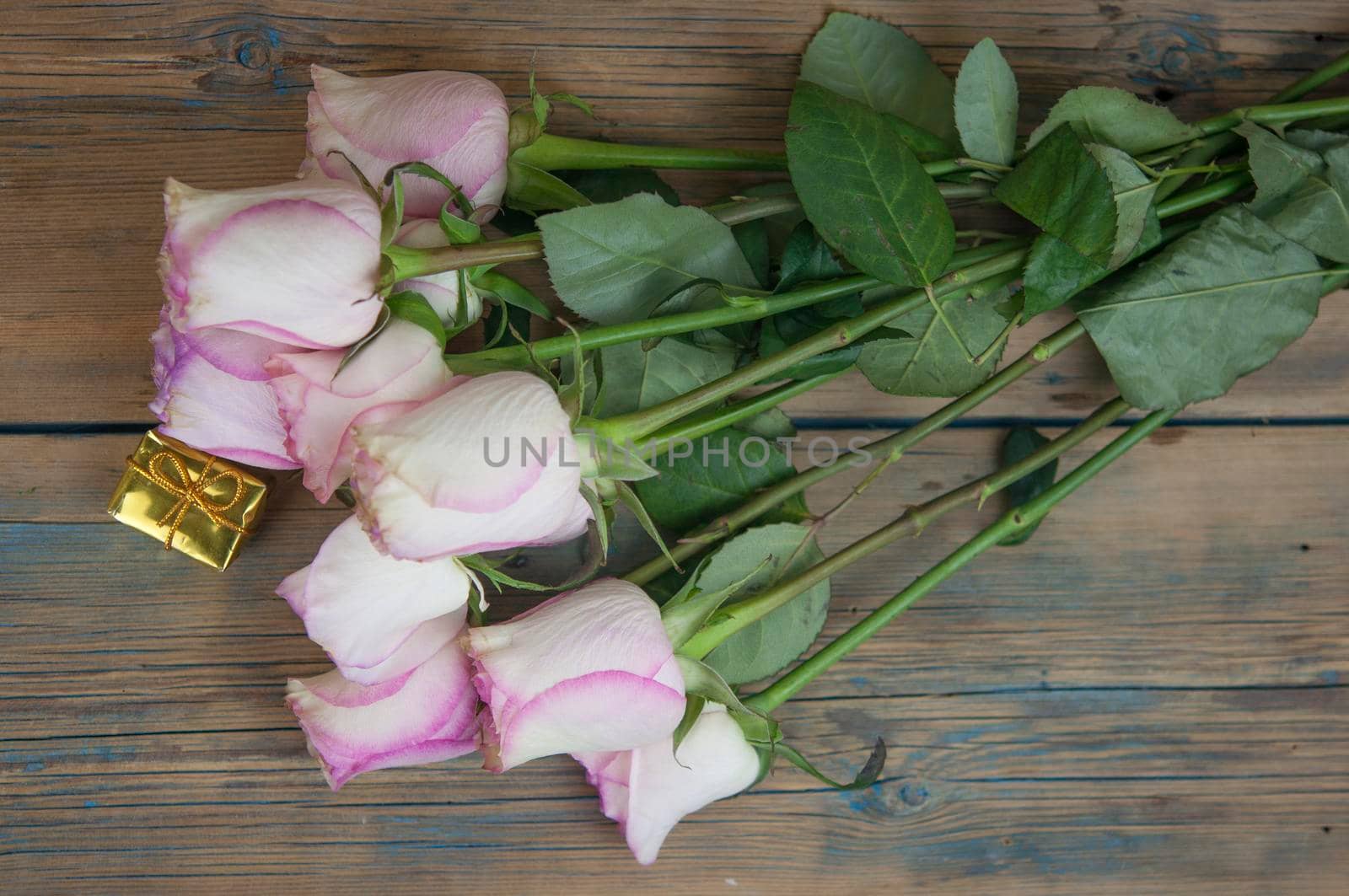 Pink roses on wood background. Mothers day roses, Bouquet of pink roses, Floral background image with copy space for text