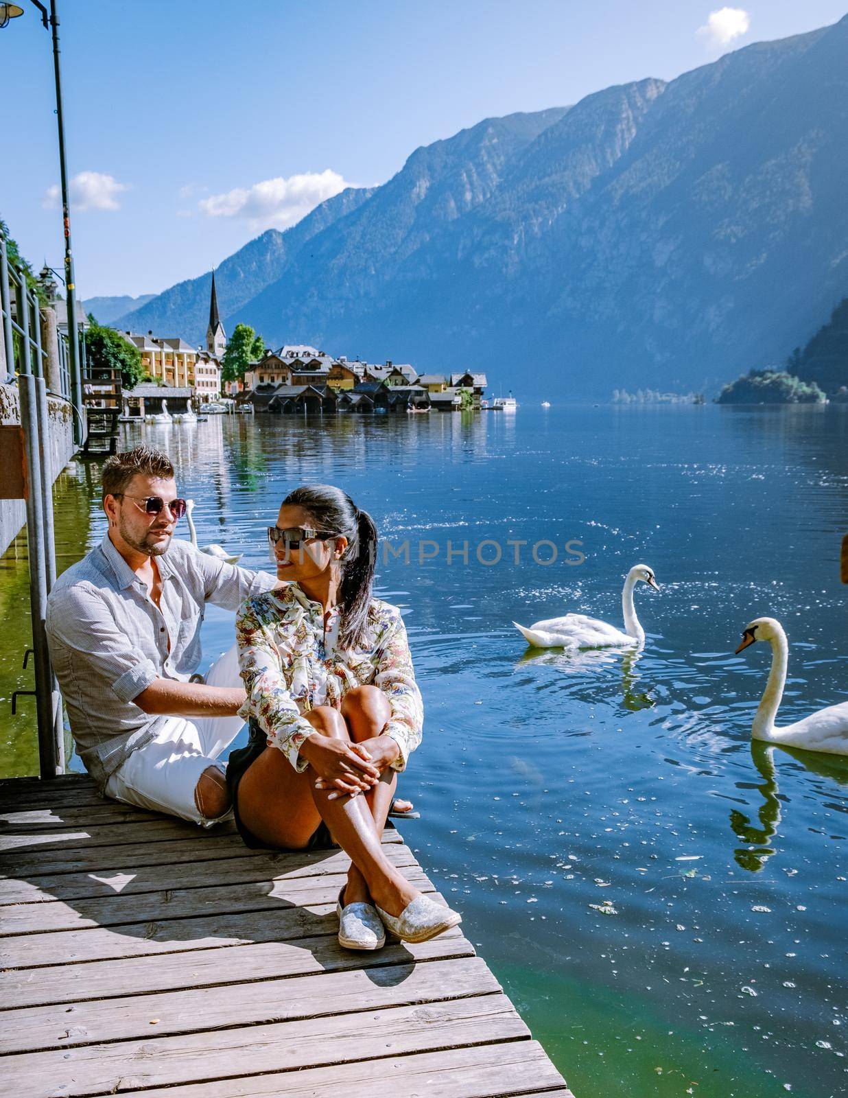 Hallstatt Austria, couple visit Hallstatt during summer vacation Hallstatter lake by fokkebok