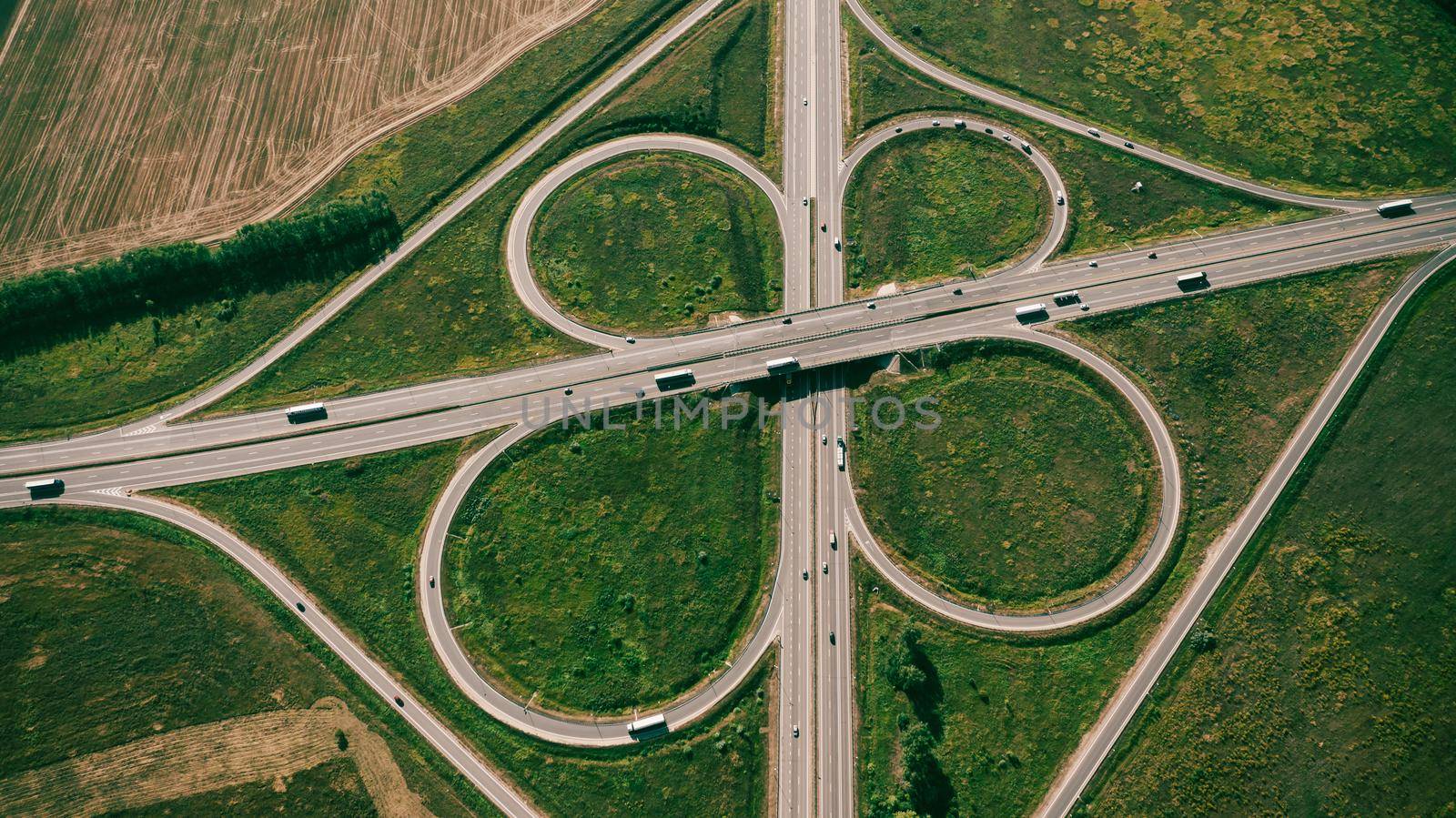 Clover or daisy type of road junction. Aerial view of highway road junction by fascinadora