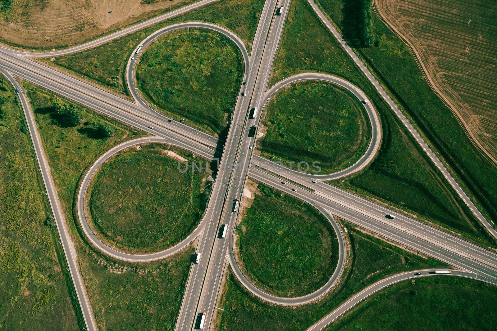 Clover or daisy type of road junction. Aerial top view by fascinadora
