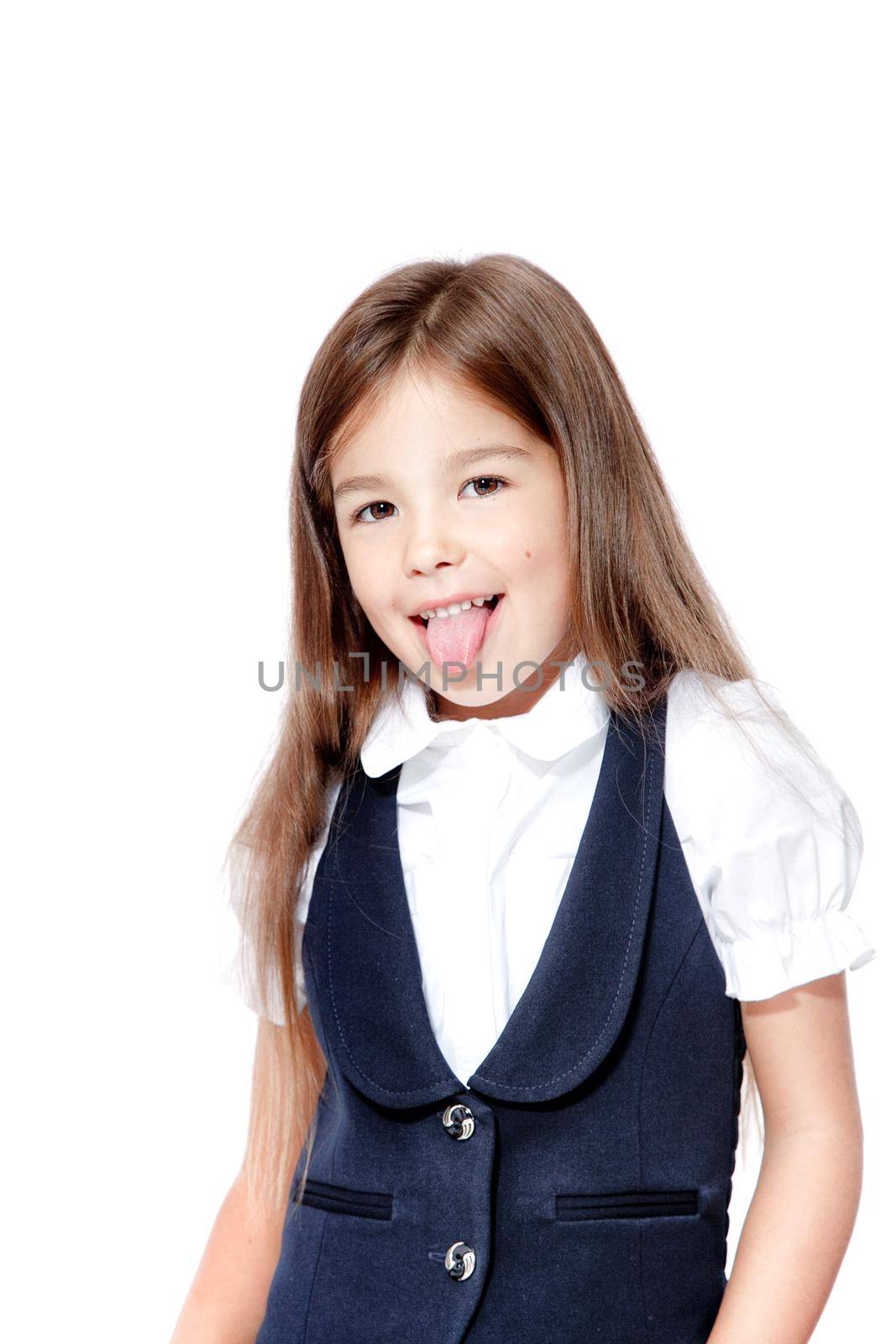 Portrait of cute smiling schoolgirl shows tongue, isolated on white background. by Taut