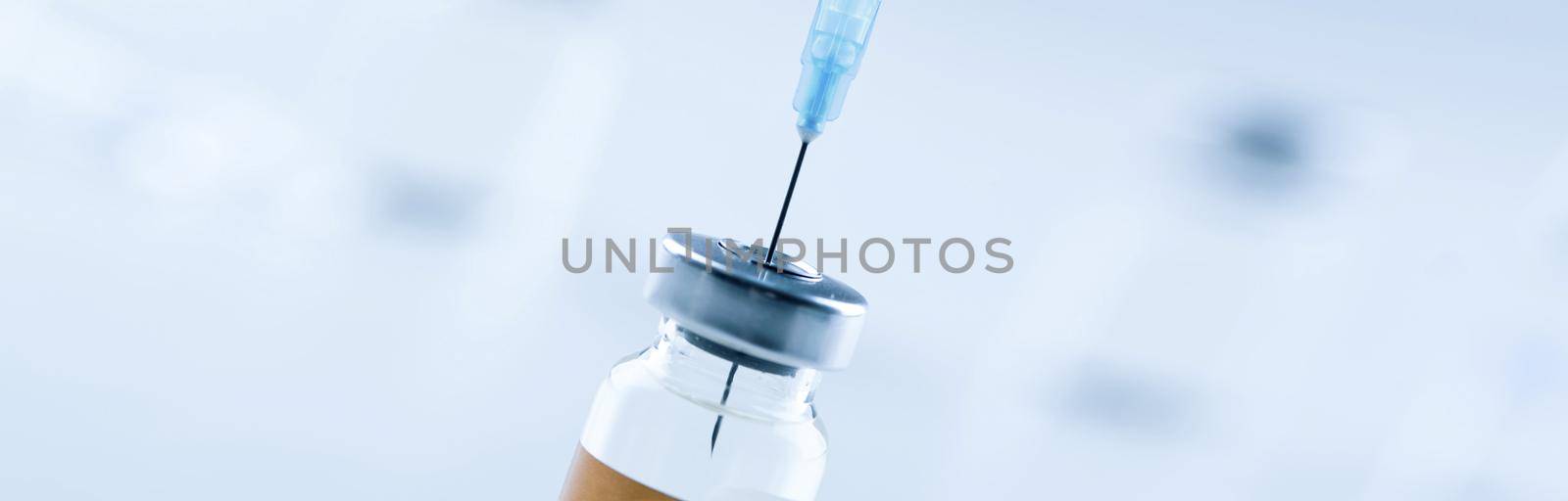 Medical syringe with a needle and a bollte with vaccine. by Taut