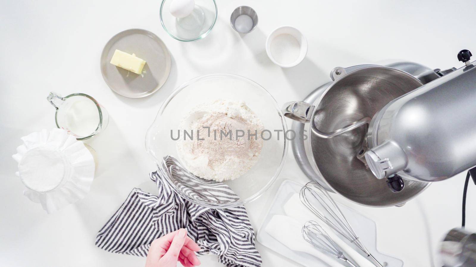 Flat lay. Mixing ingredients in a kitchen standing mixer to bake cinnamon rolls.