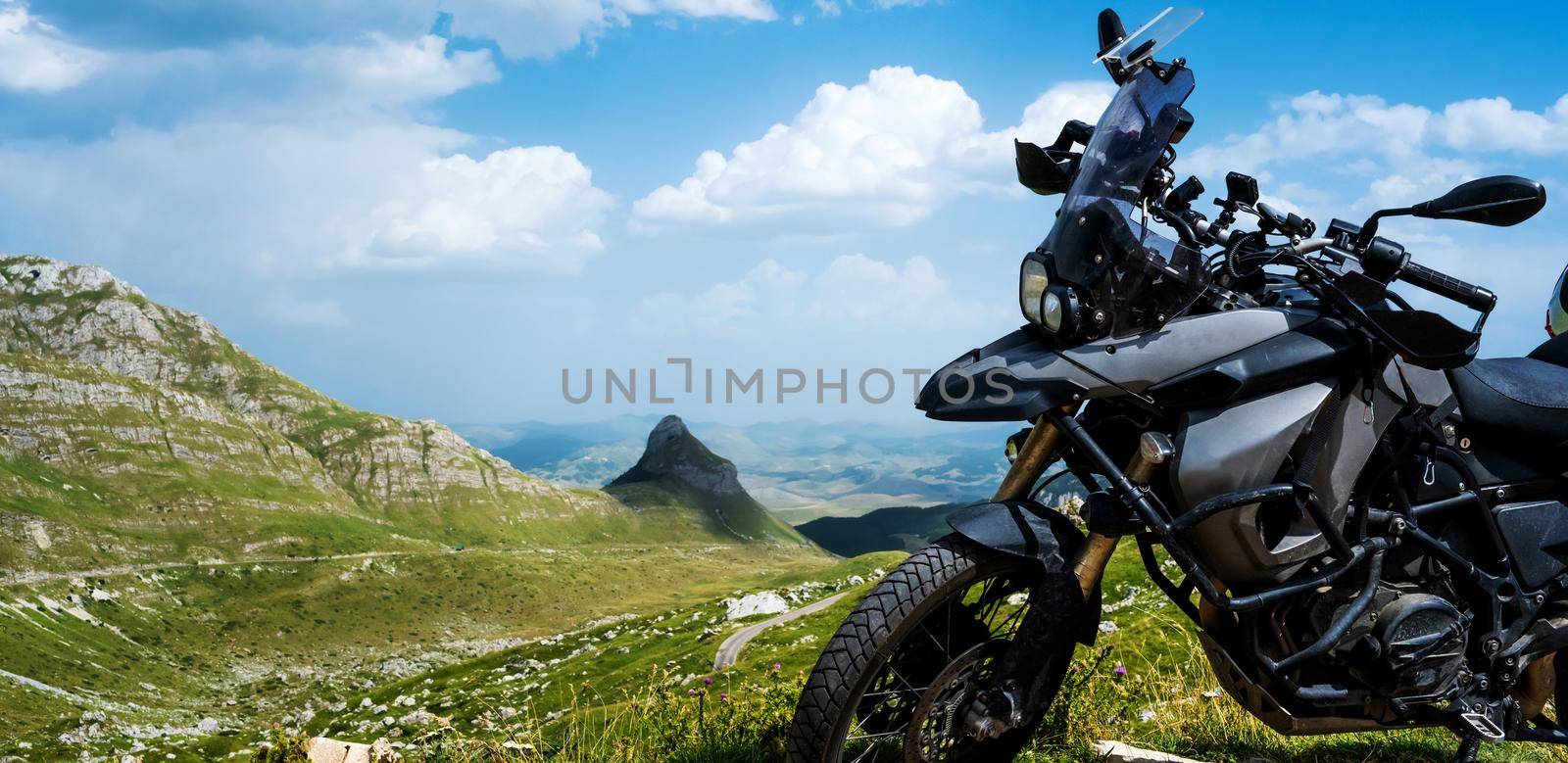 Motocycle bike in the mountains in National park Durmitor in Montenegro with amazing nature landscape, closeup view on vehicle